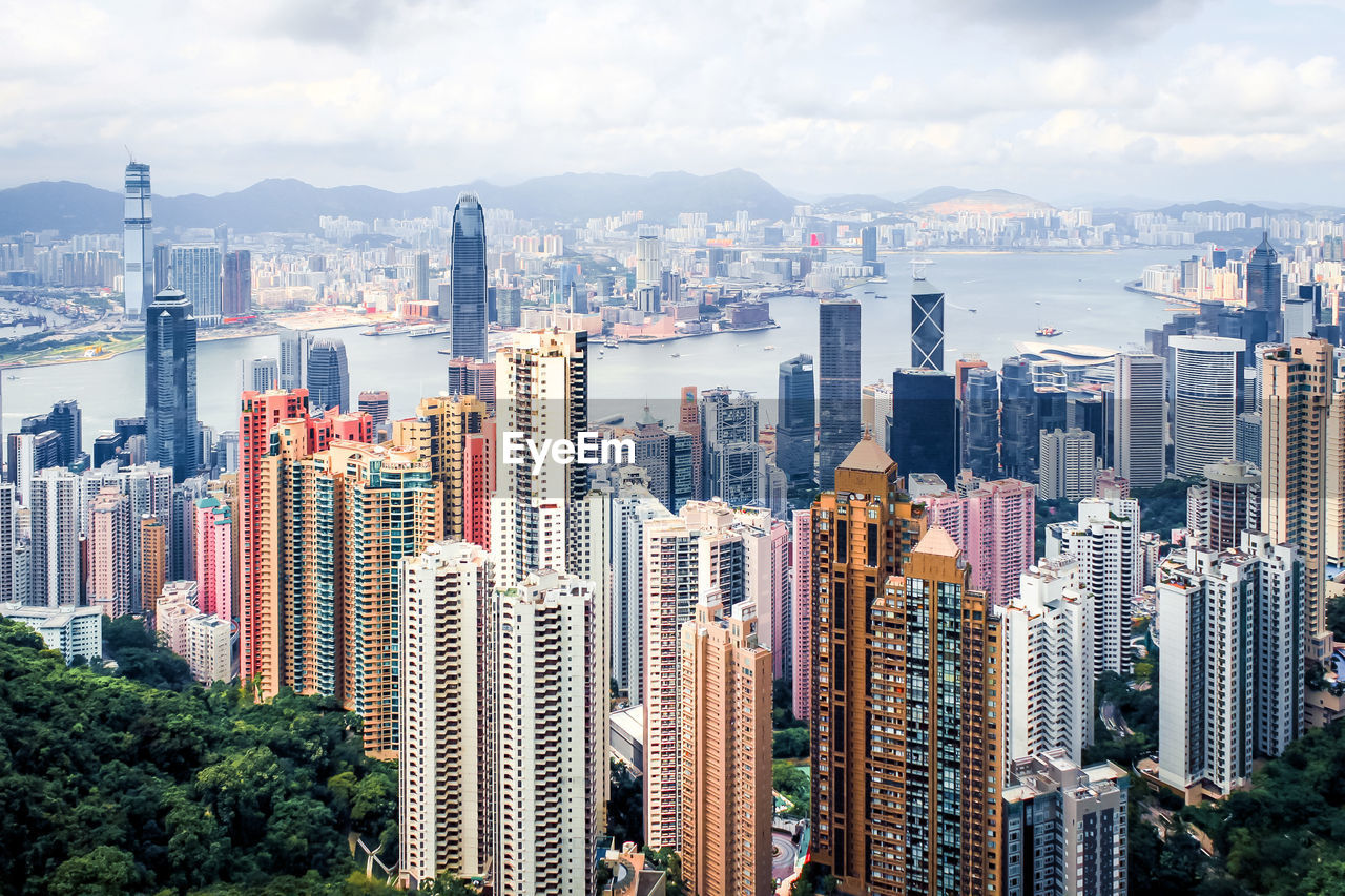 Aerial view of modern buildings in city against sky