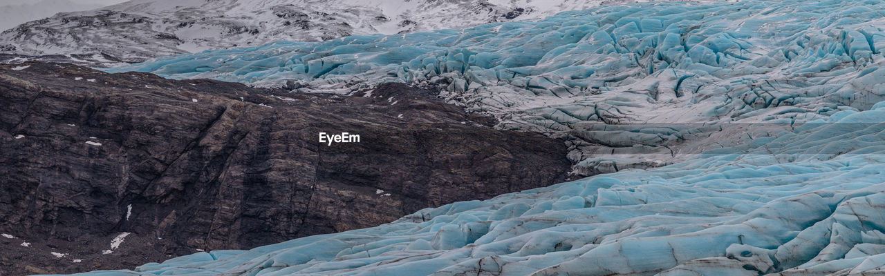 Glacier meets mountain rock