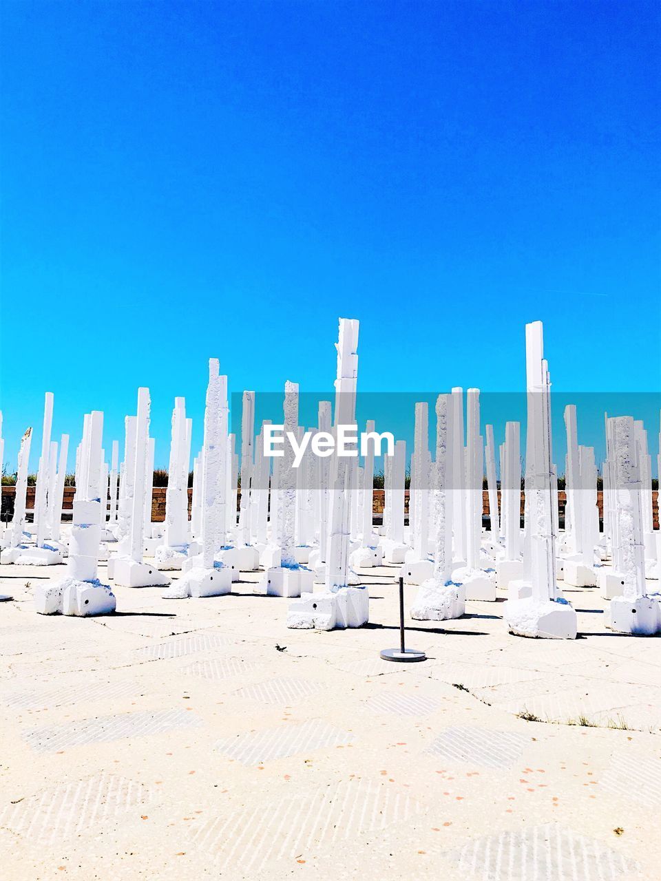 Panoramic view of land against clear blue sky