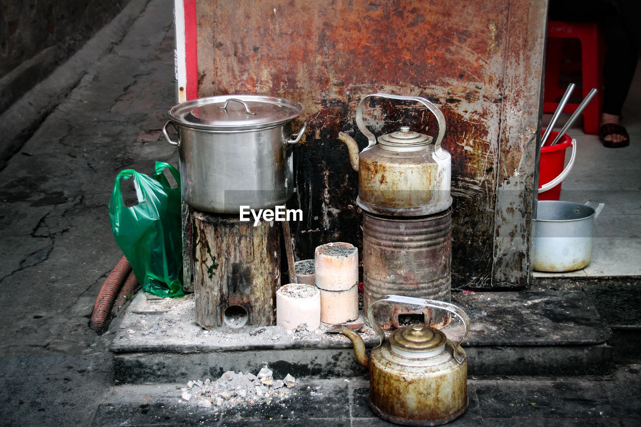 Kitchen utensils and kettles at street tea stall