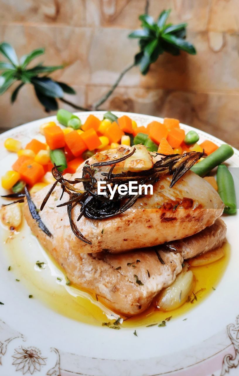 High angle view of fish served in plate on table
