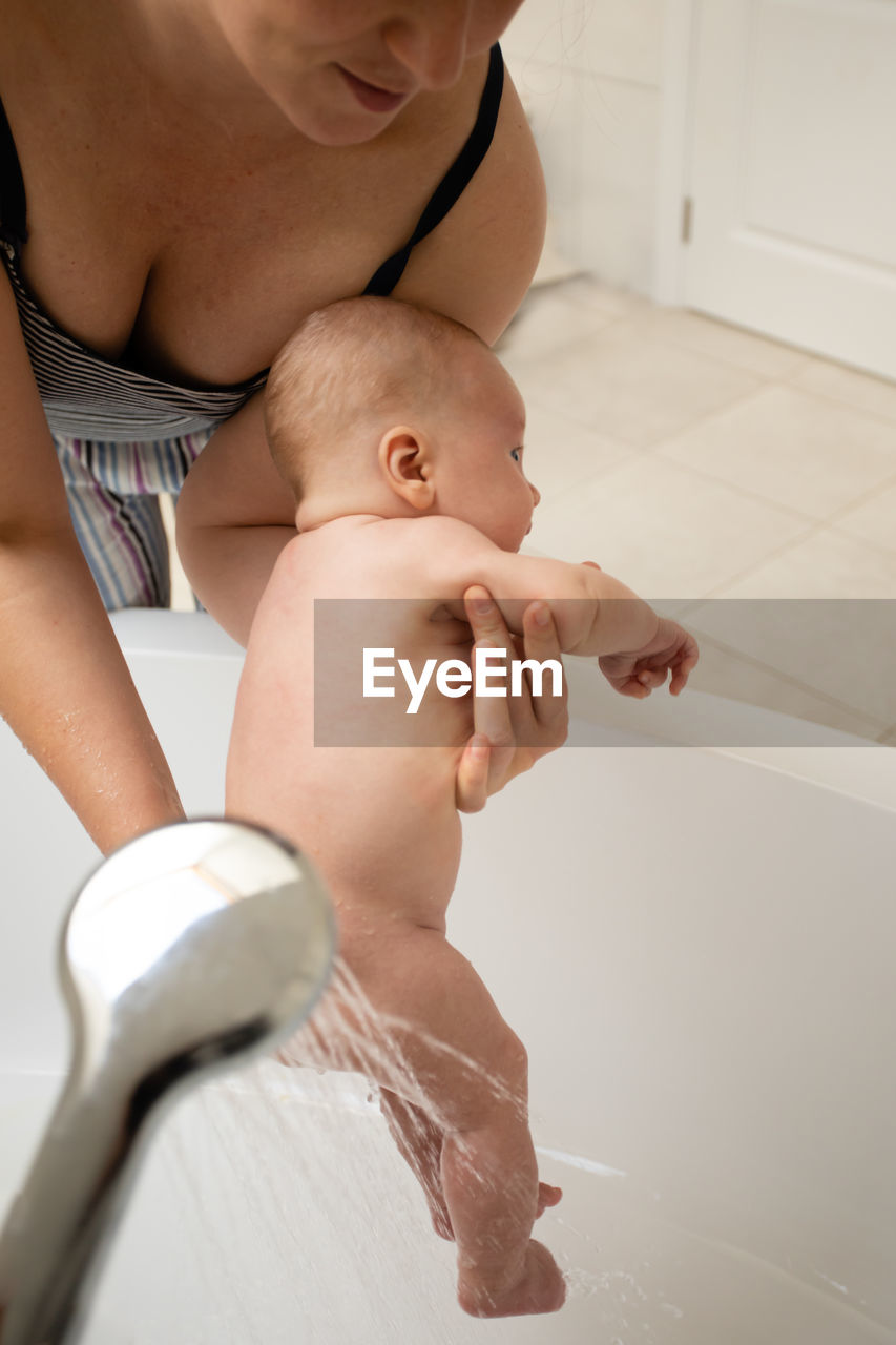 High angle view of baby girl in bathroom