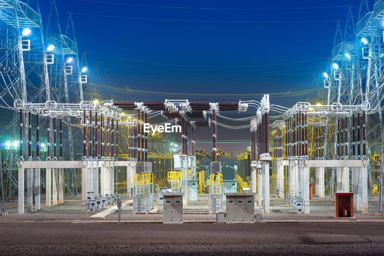 View of an electric substation at night