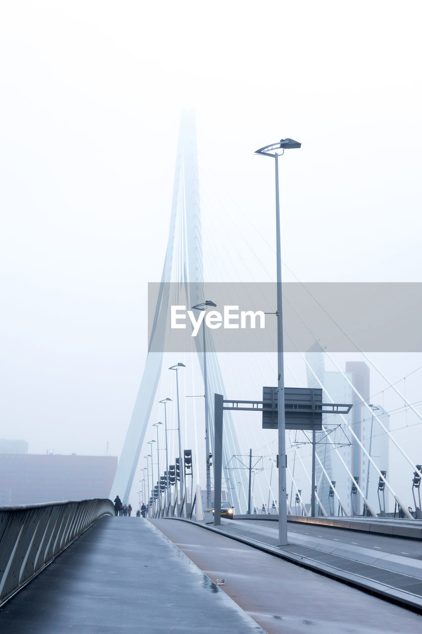 Erasmus bridge against sky during foggy weather