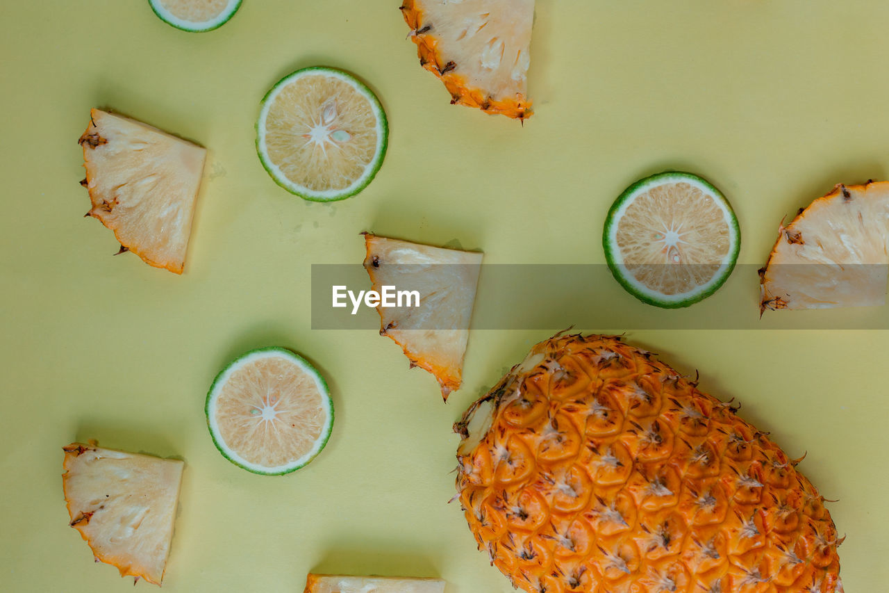 food and drink, fruit, food, slice, healthy eating, citrus fruit, directly above, orange, high angle view, freshness, indoors, no people, produce, wellbeing, dish, table, citrus, knolling - concept, fish, plant, lemon, studio shot, drink, still life