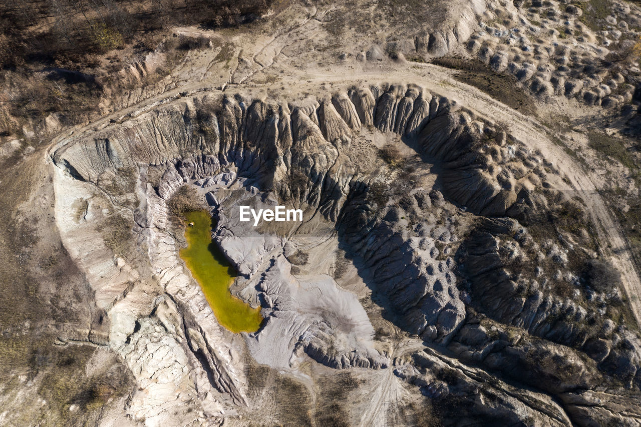 Abandoned industrial mining area. drone view of opencast mine filled with water. aerial shot
