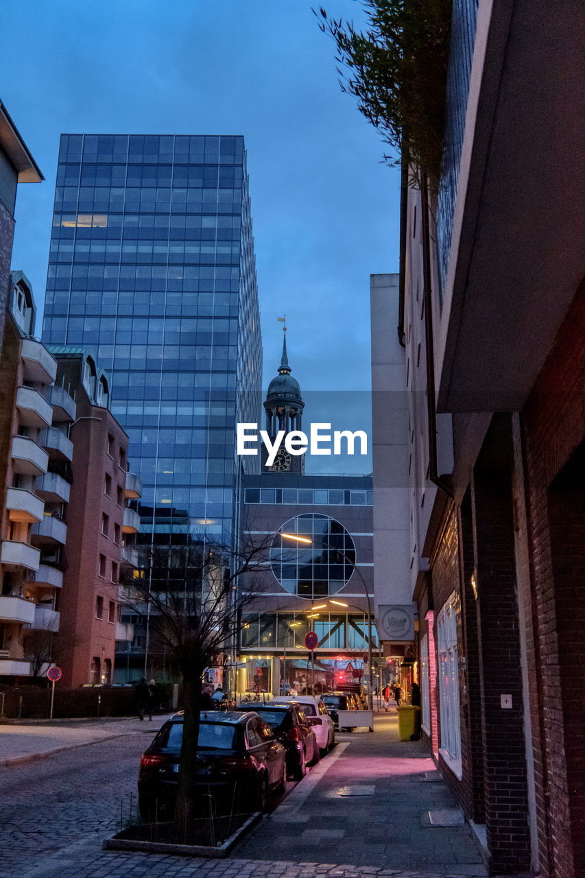 STREET AMIDST BUILDINGS IN CITY