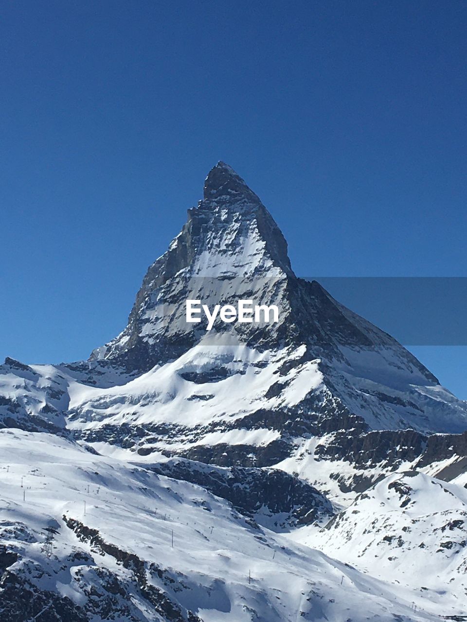 Scenic view of  the matterhorn against clear blue sky