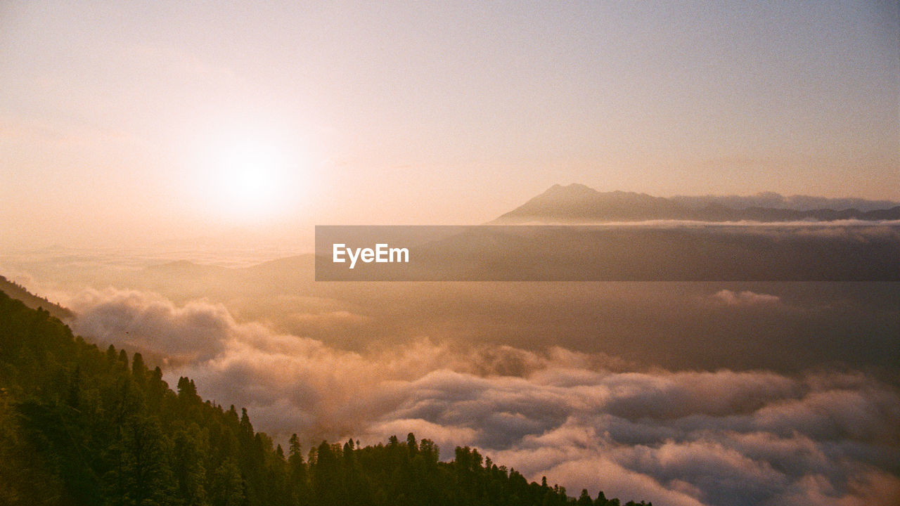 Scenic view of mountains against sky during sunset