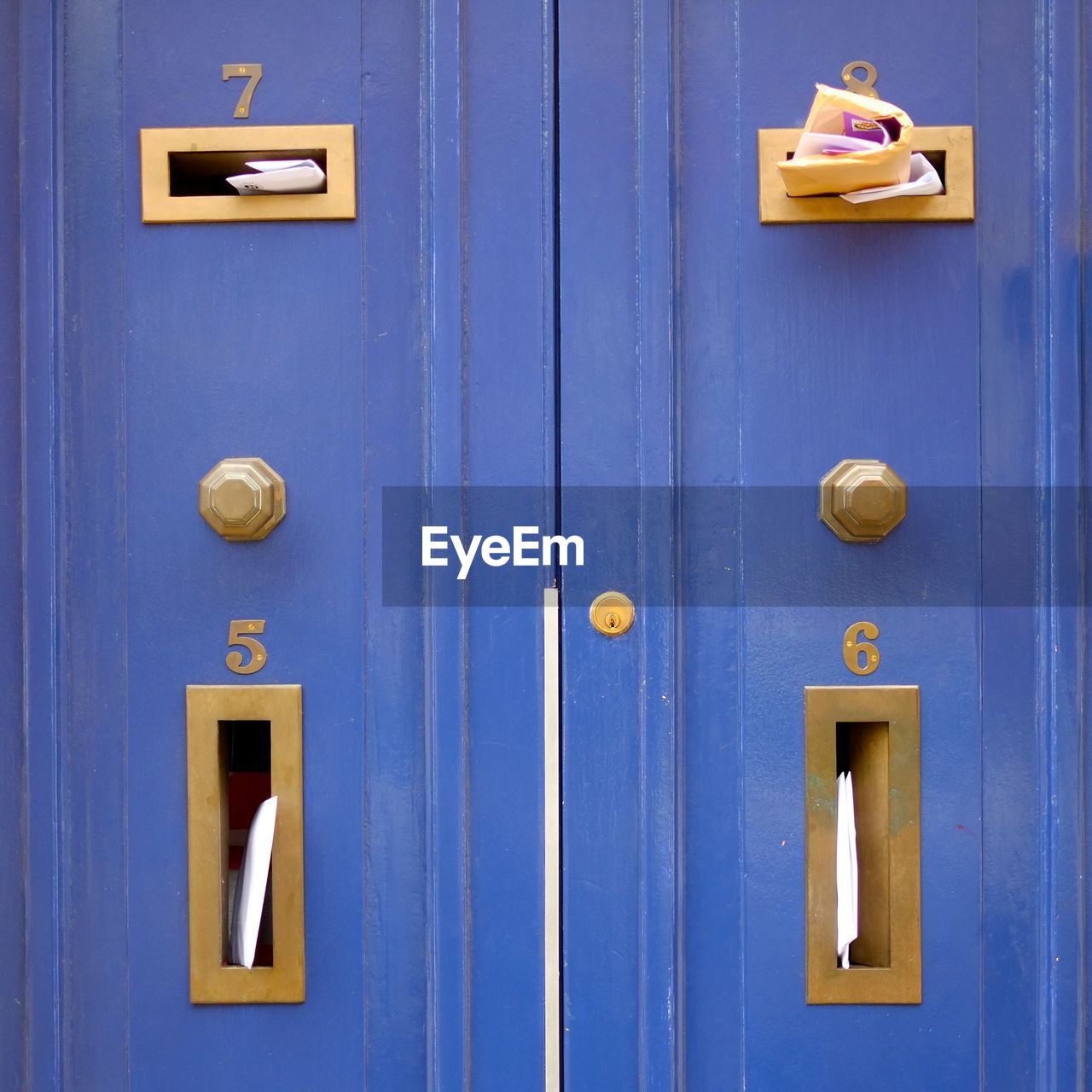 Full frame of blue mailbox with numbers