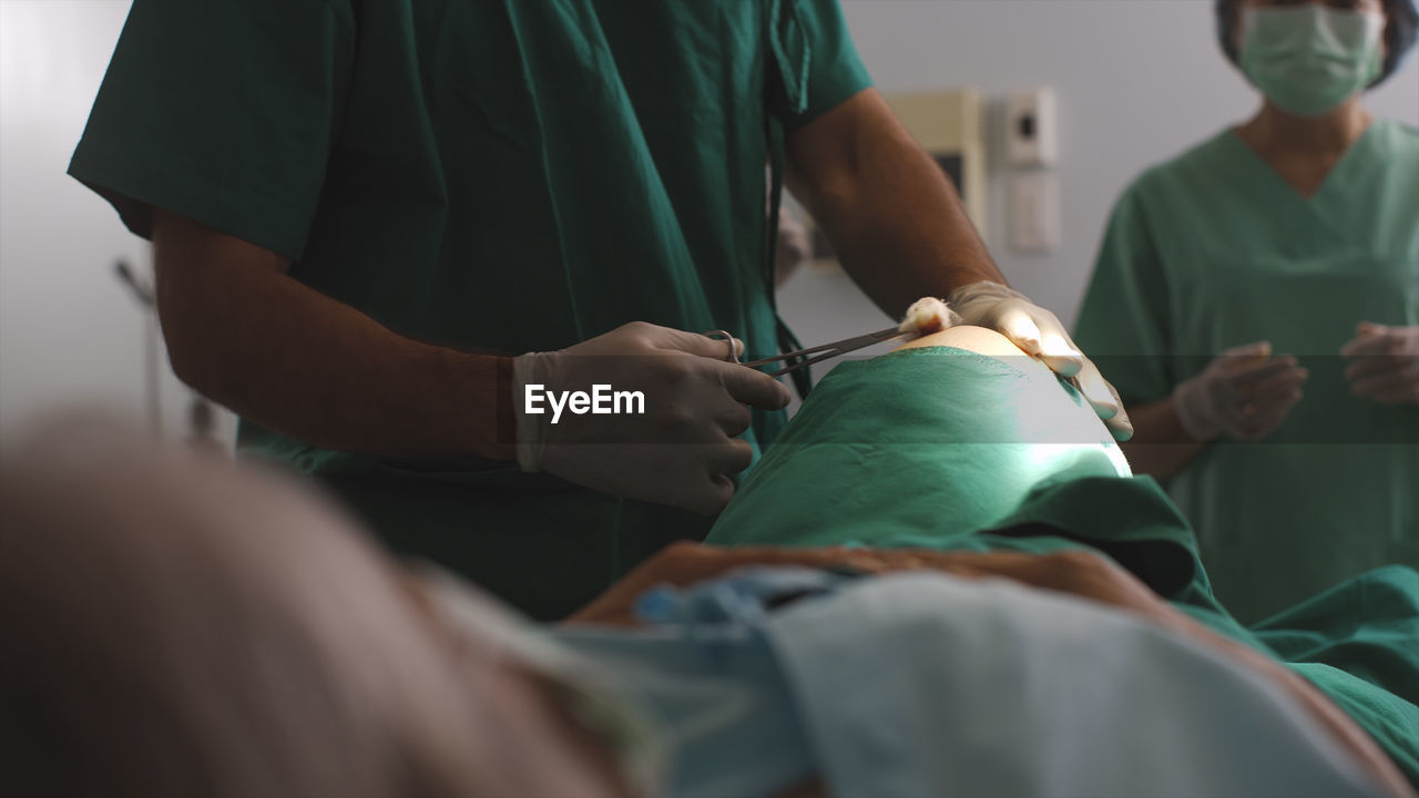 Surgeon diagnose a senior woman knee problem before a replacement surgical procedure