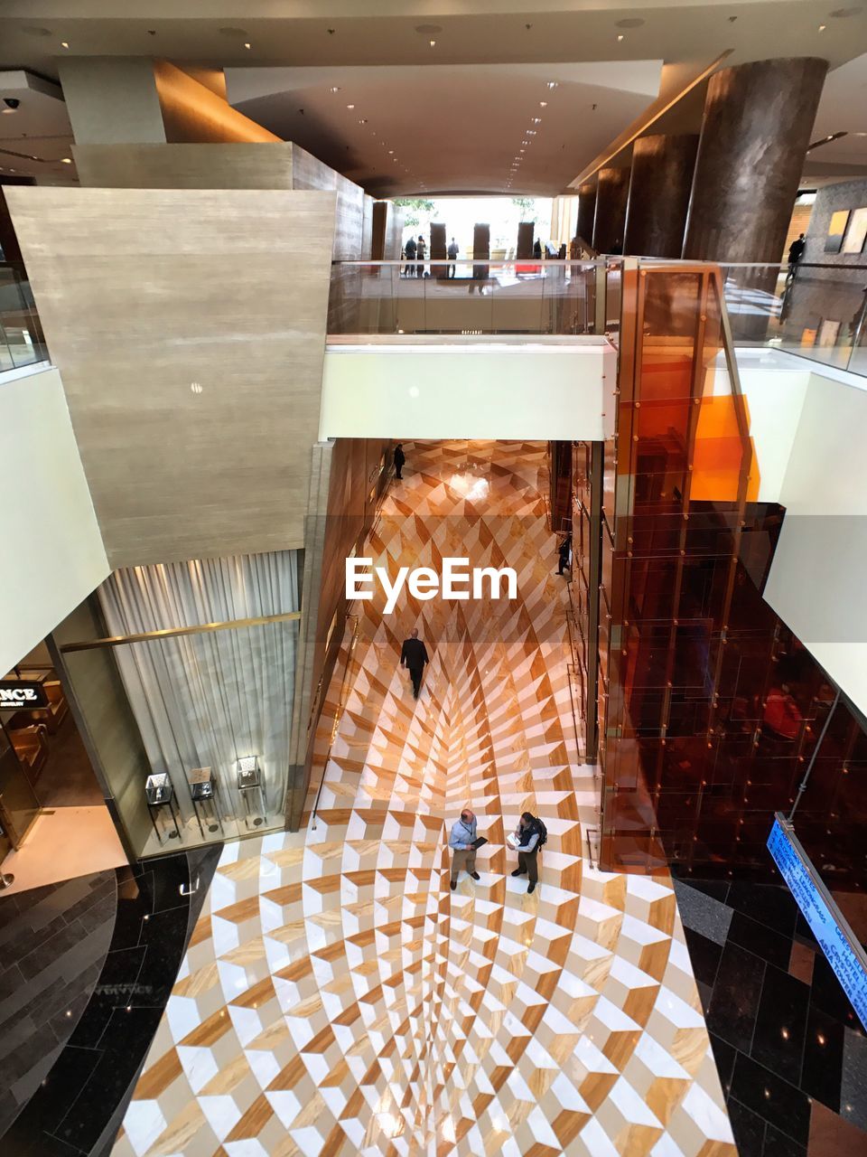 HIGH ANGLE VIEW OF SHOPPING MALL ON STAIRCASE IN TOWN