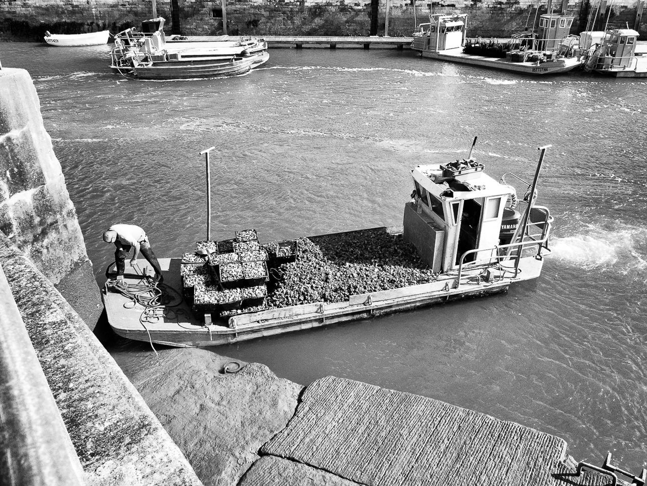 BOATS MOORED IN WATER