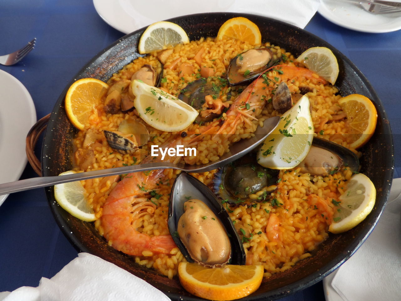 High angle view of paella in container on table