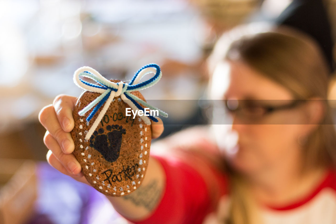 Close-up of woman holding decoration