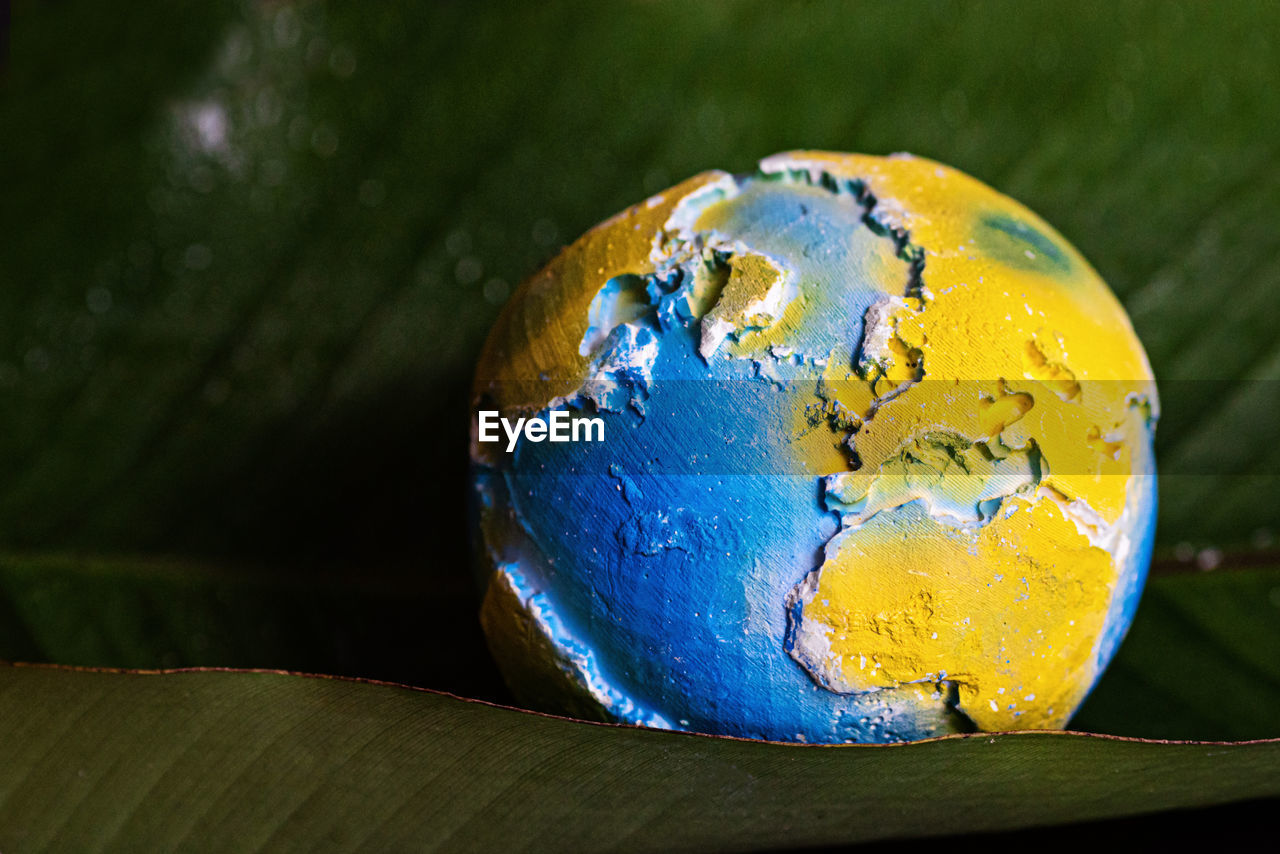 close-up of globe on wood