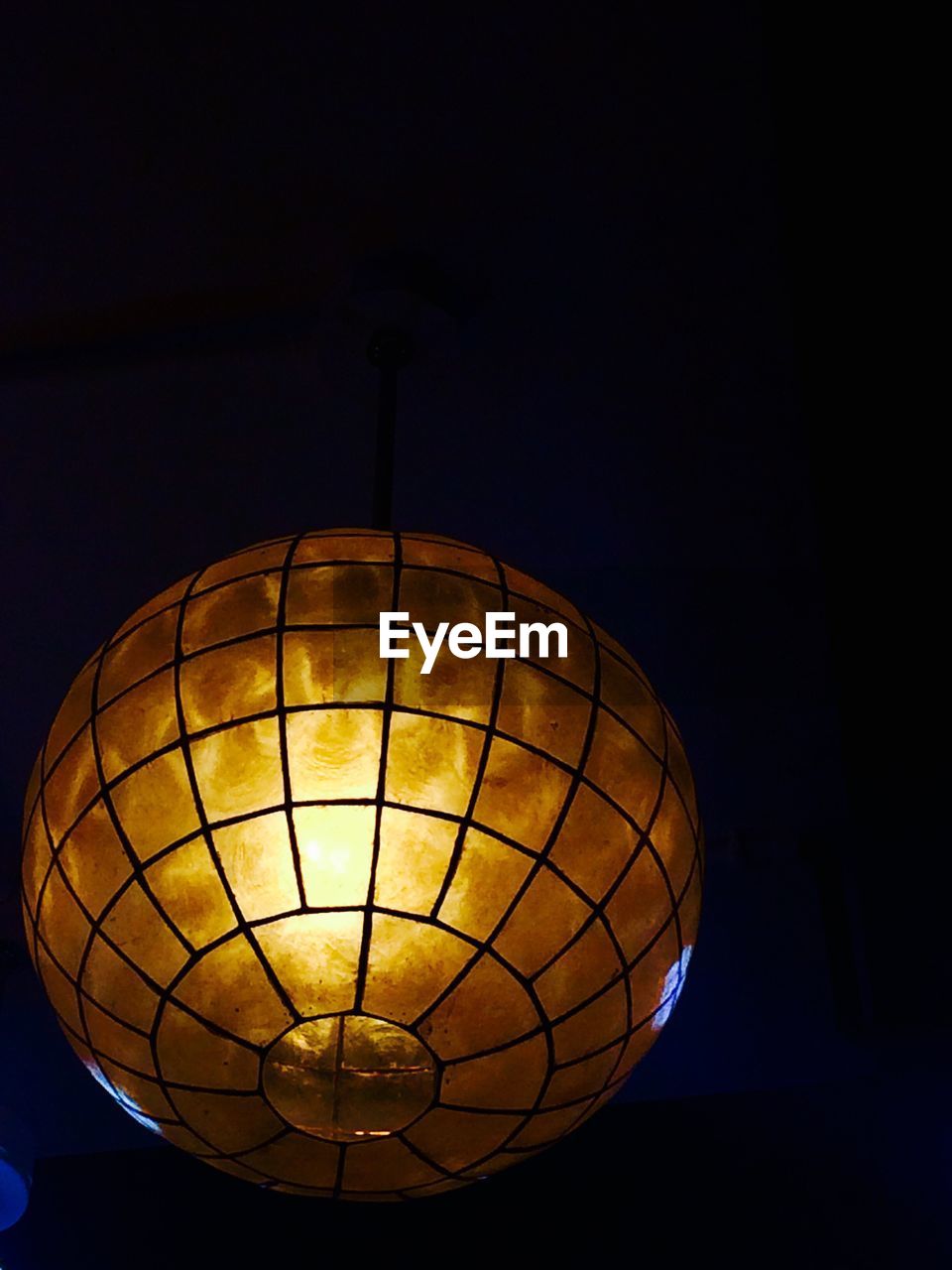 LOW ANGLE VIEW OF ILLUMINATED LIGHTING EQUIPMENT