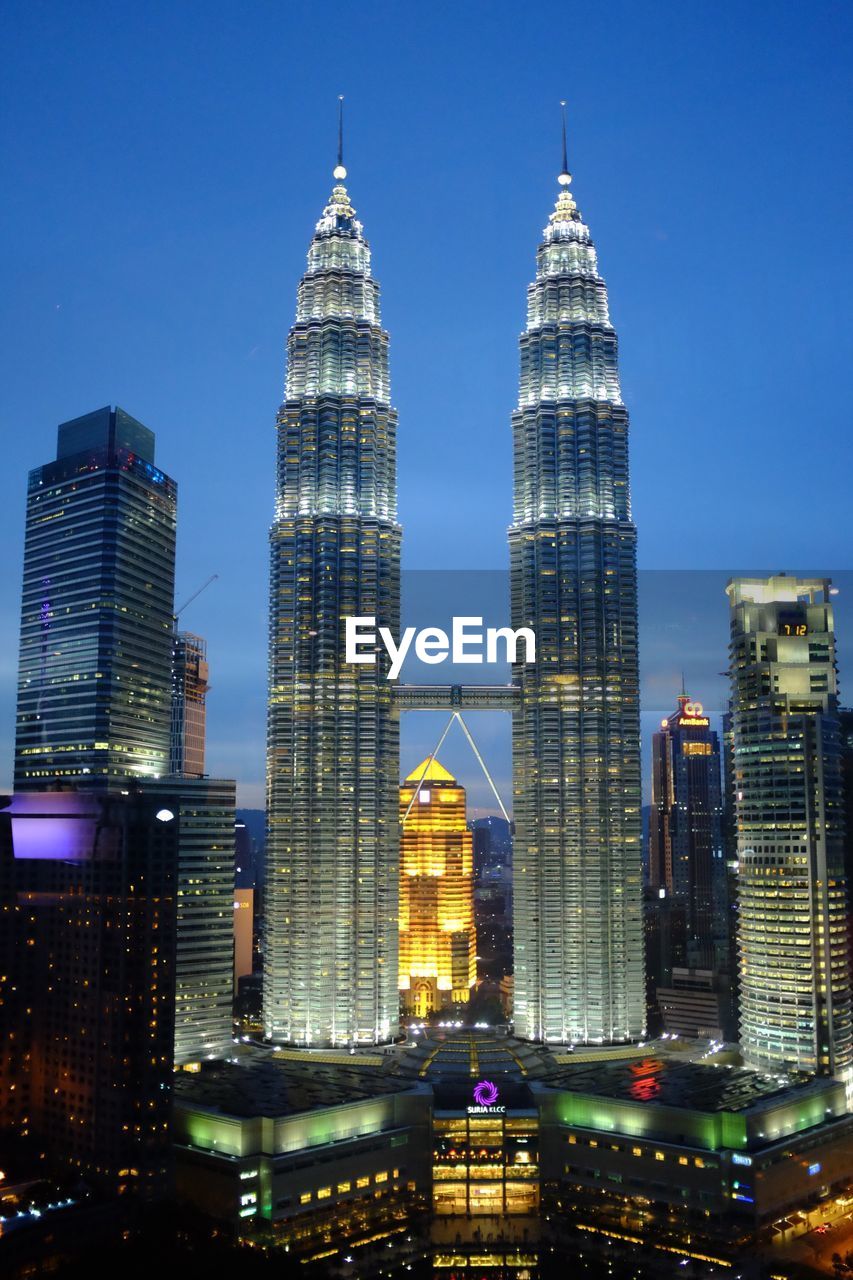 MODERN SKYSCRAPERS LIT UP AT NIGHT