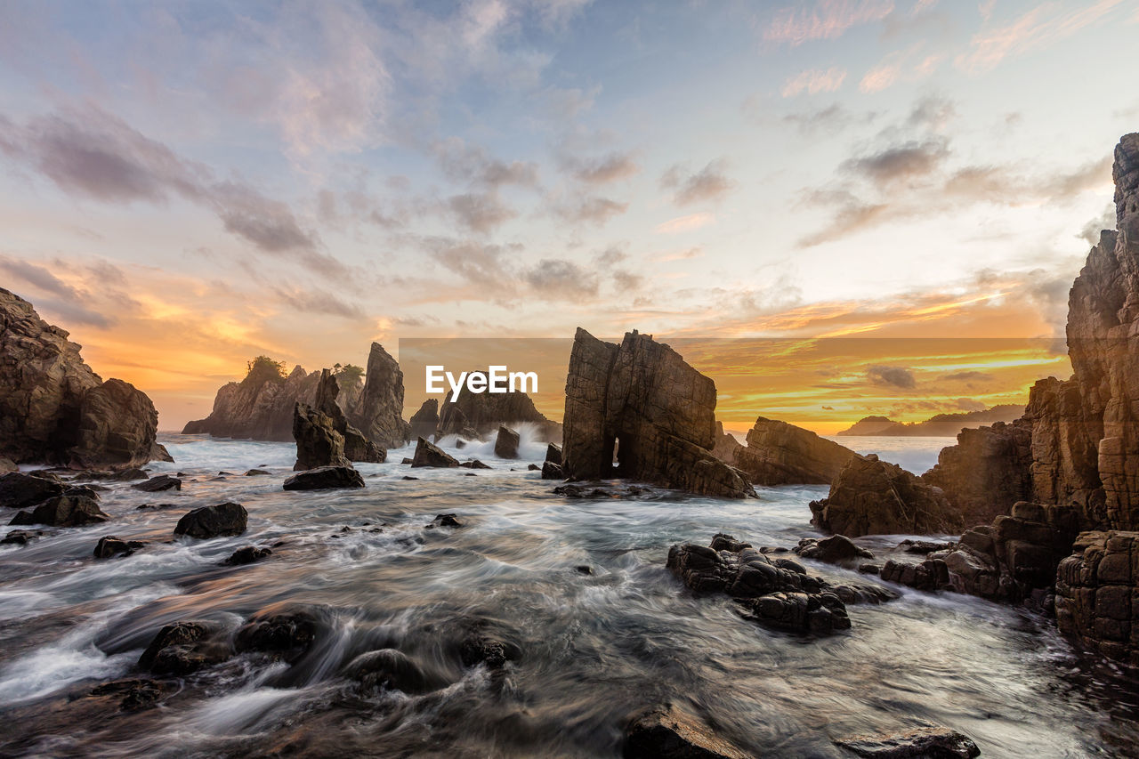 Scenic view of sea against sky at sunset