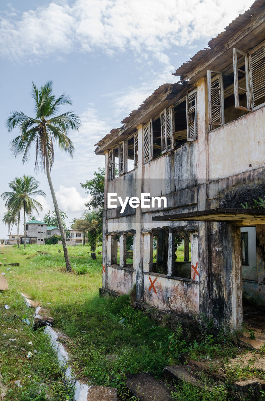 Abandoned ruined building against sky, robertsport, liberia