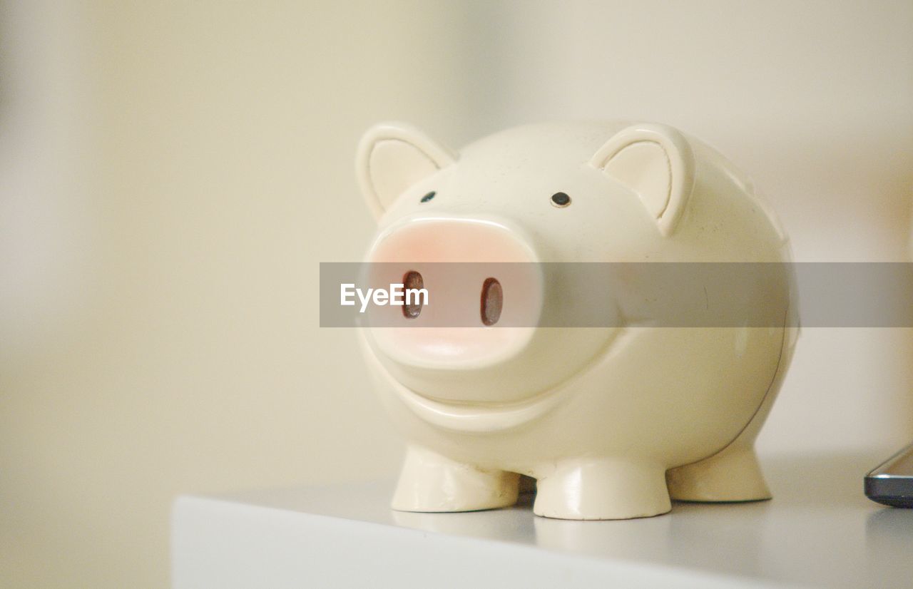 Close-up of piggy bank on table