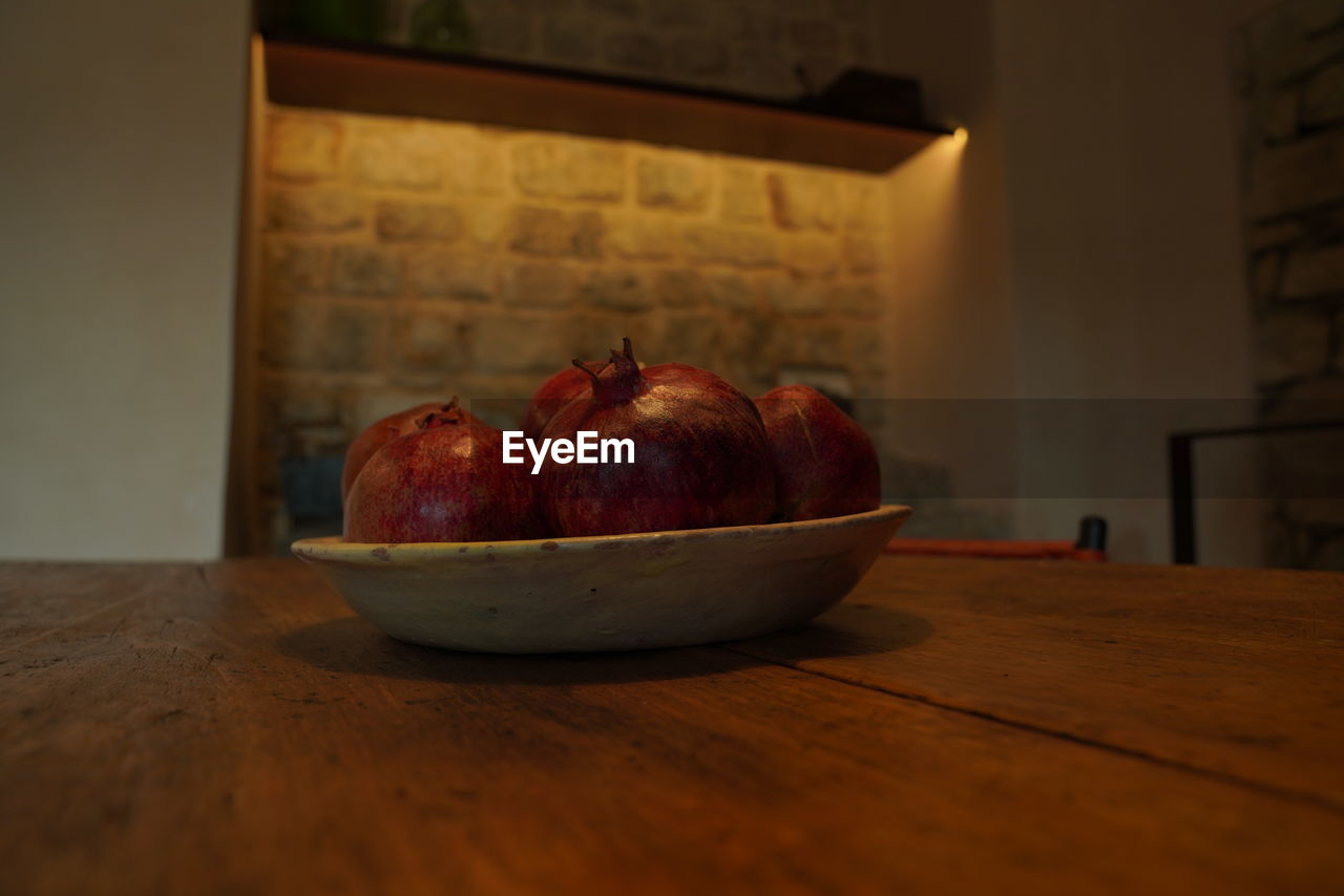 food and drink, food, healthy eating, wellbeing, still life photography, fruit, still life, indoors, table, freshness, red, wood, no people, painting, apple - fruit, apple, plant, produce, domestic room, bowl, pomegranate