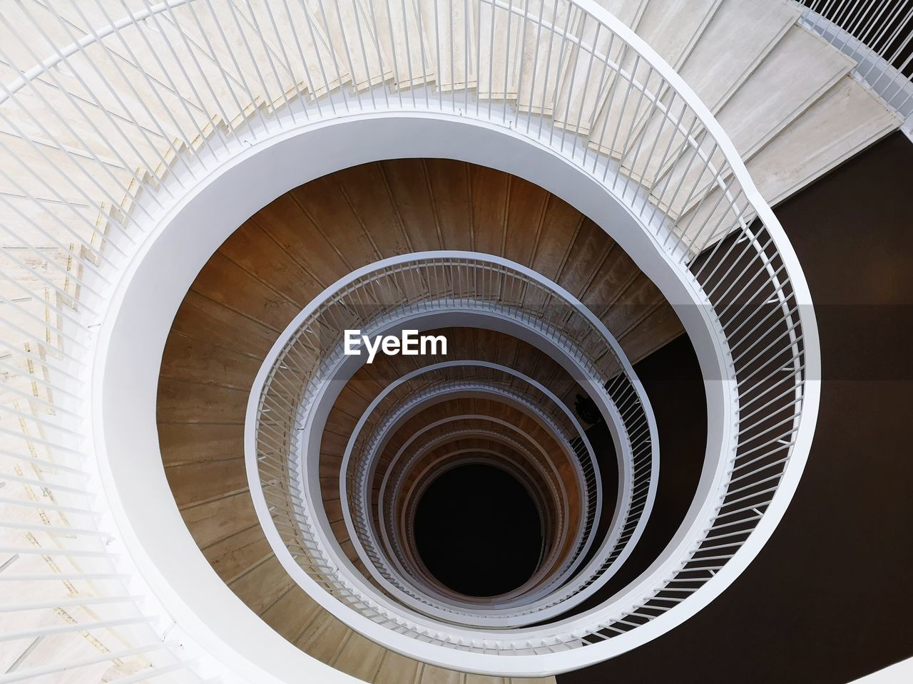 Directly below shot of spiral staircase of building