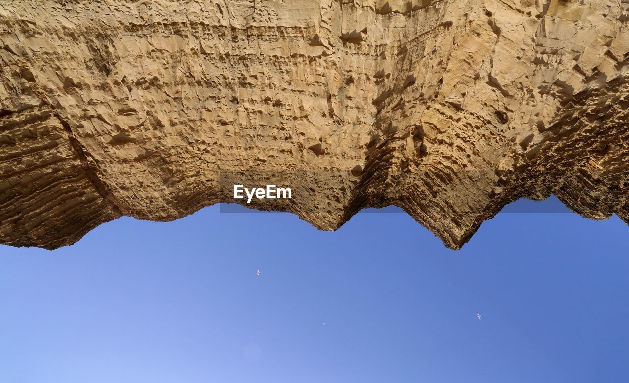 Low angle view of rock formations