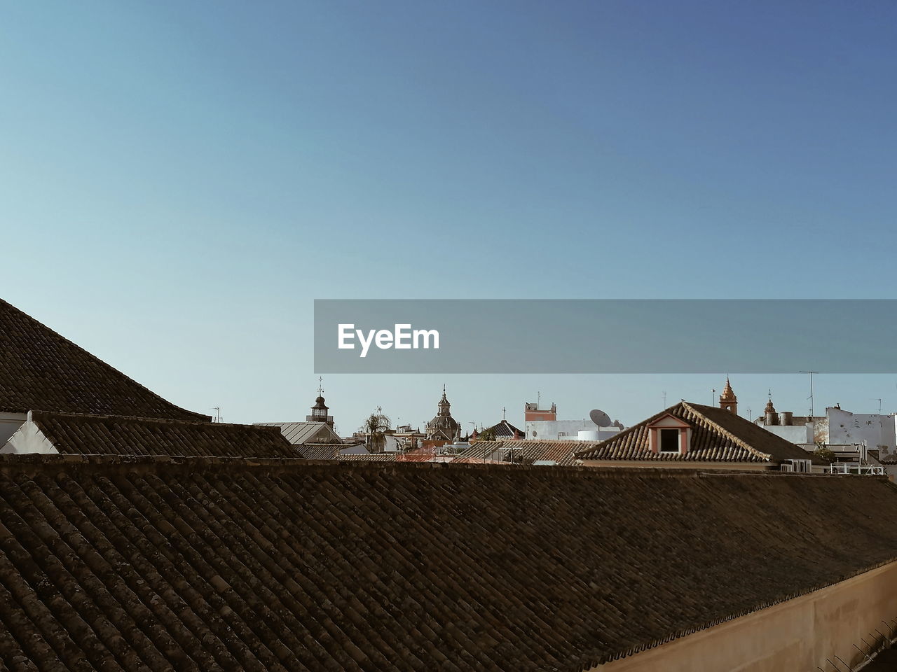 ROOF OF BUILDING AGAINST CLEAR SKY