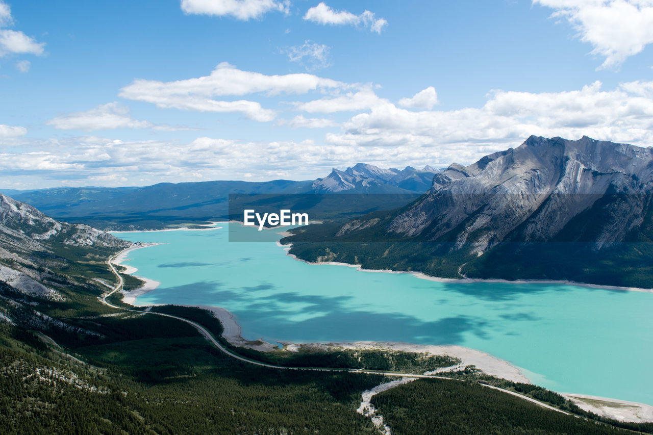 Panoramic view of sea and mountains against sky