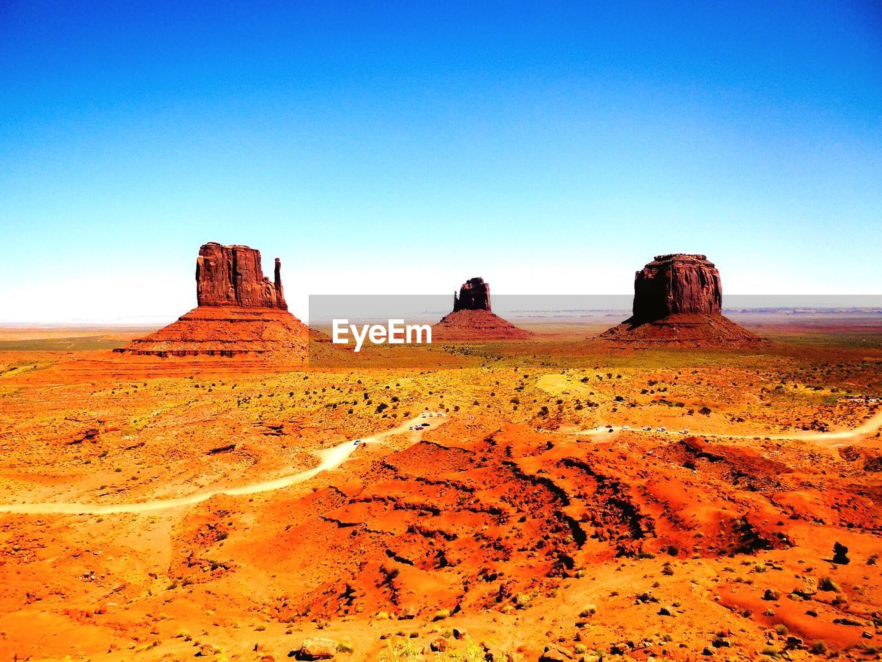 Scenic view of mountain against blue sky