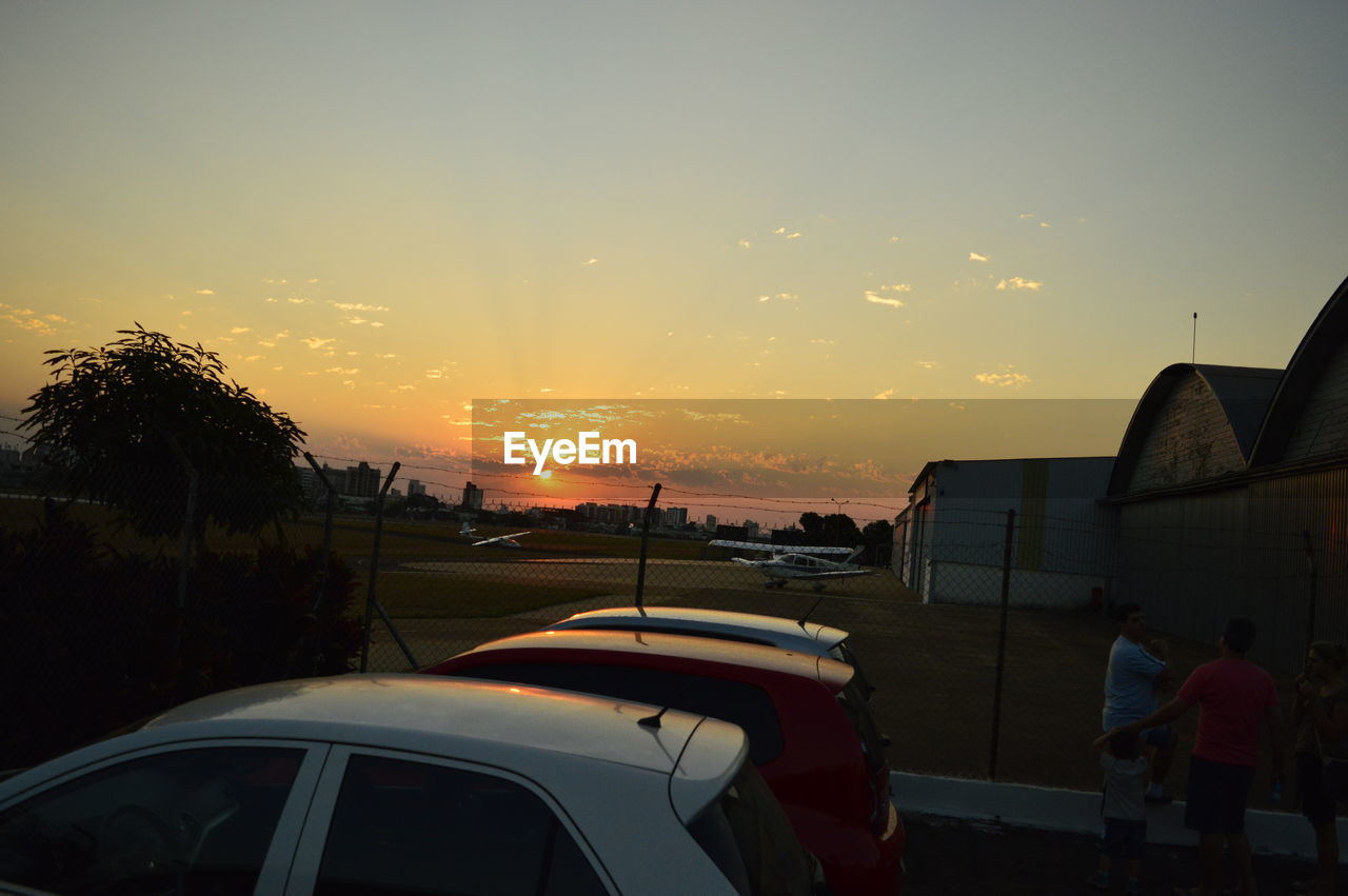 CARS ON SKY DURING SUNSET