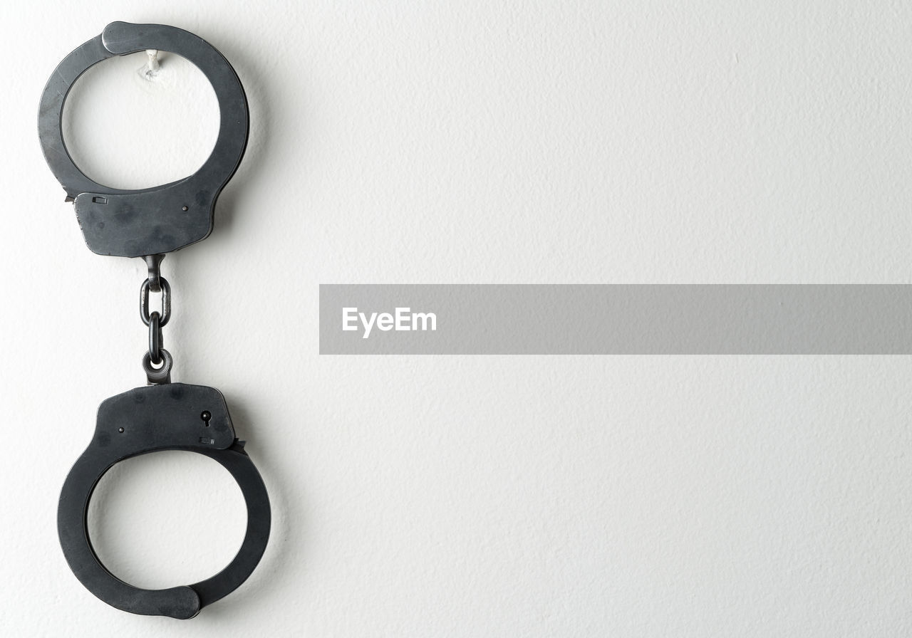 Handcuffs hanging on wall