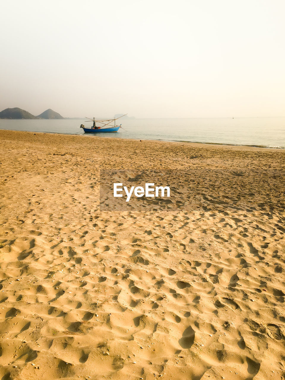 Scenic view of beach against clear sky