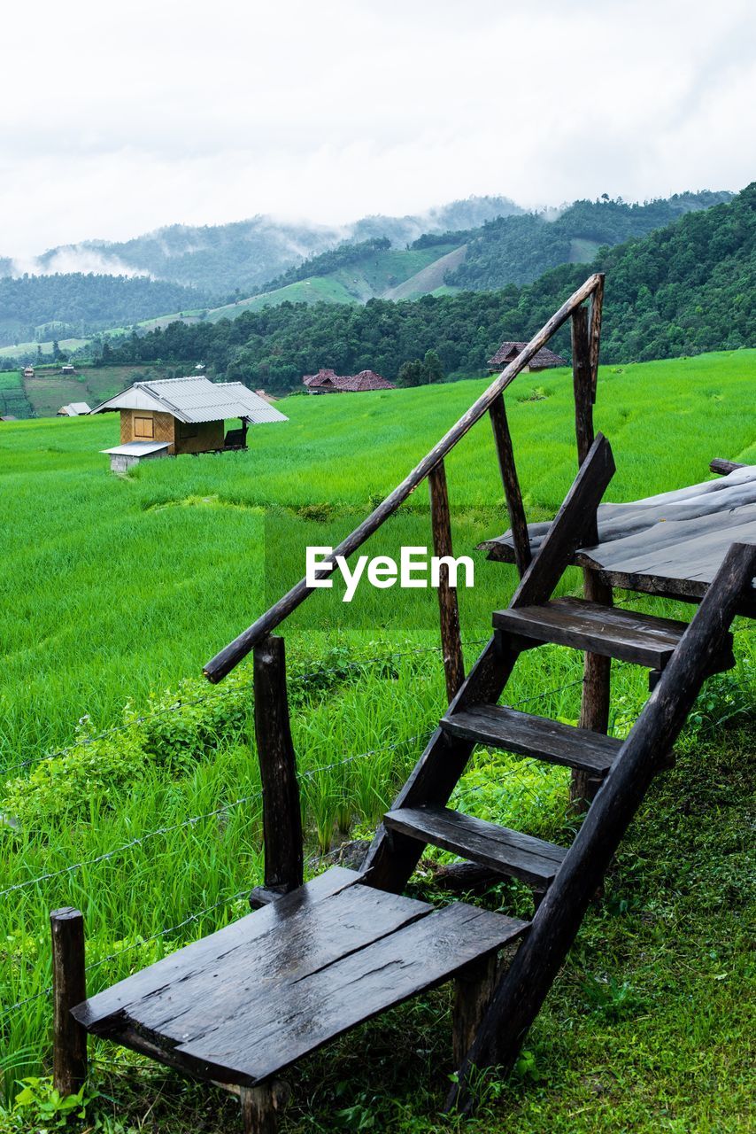 Scenic terrace view of field against sky