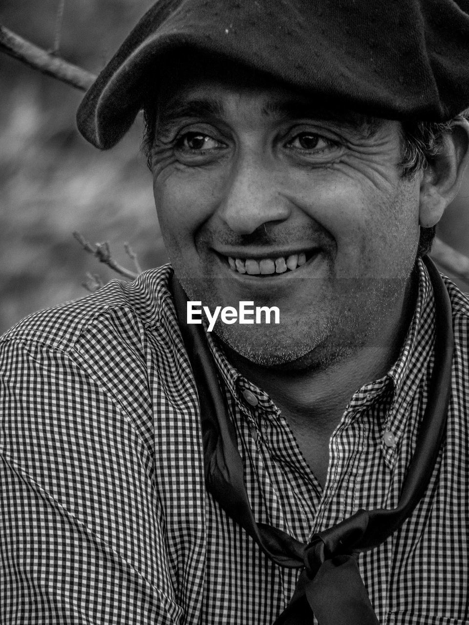 Close-up of thoughtful man smiling outdoors