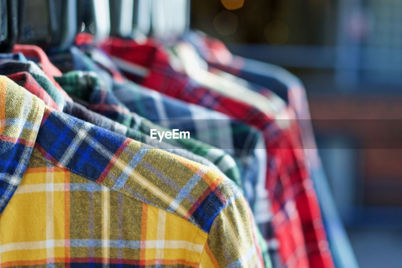 Close-up of multi colored shirts for sale in store