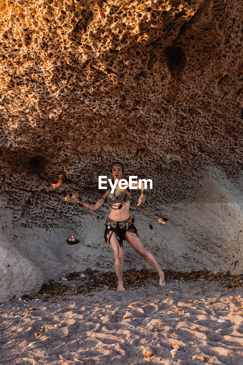 Full length of man standing on rock