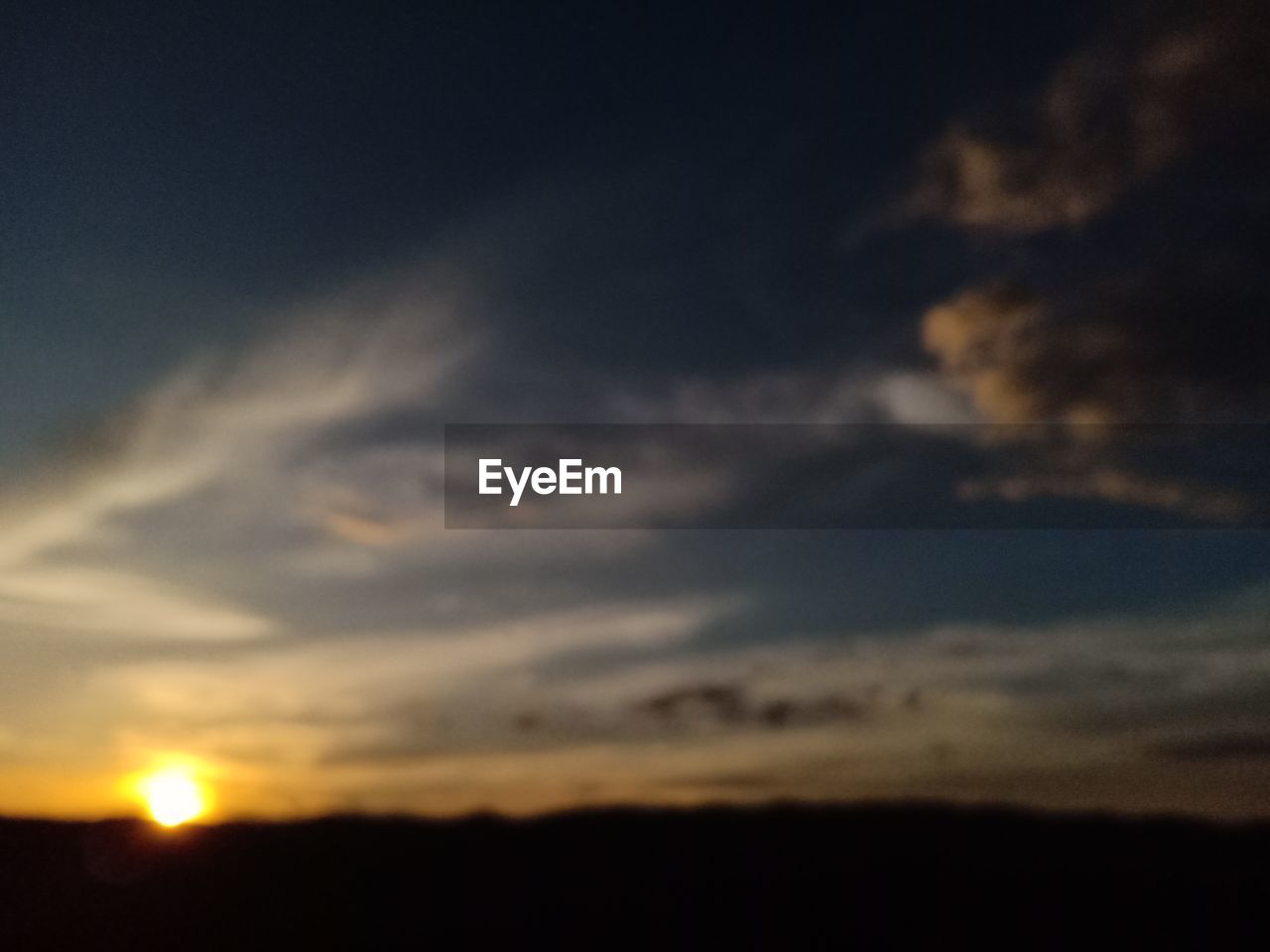LOW ANGLE VIEW OF SILHOUETTE LANDSCAPE AGAINST SKY DURING SUNSET