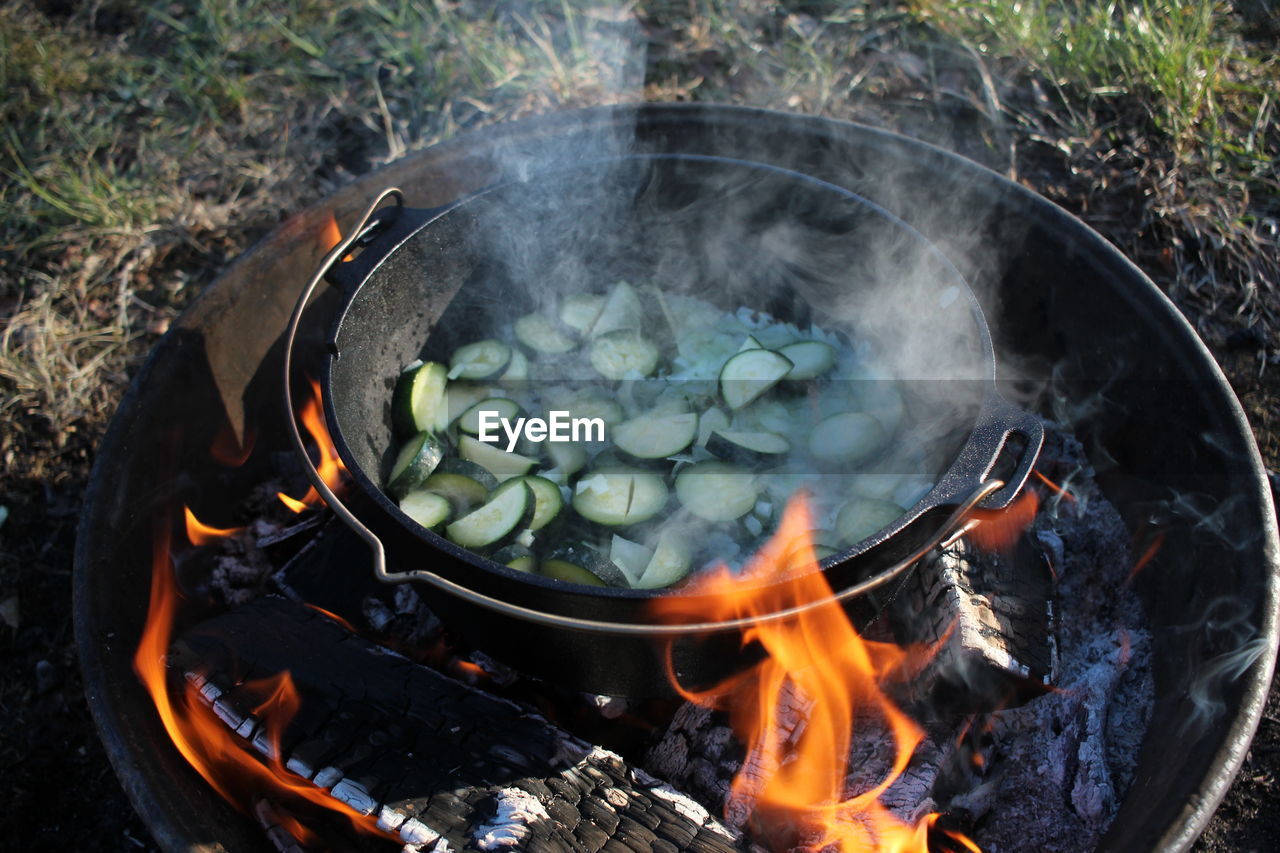 HIGH ANGLE VIEW OF BONFIRE ON BARBECUE