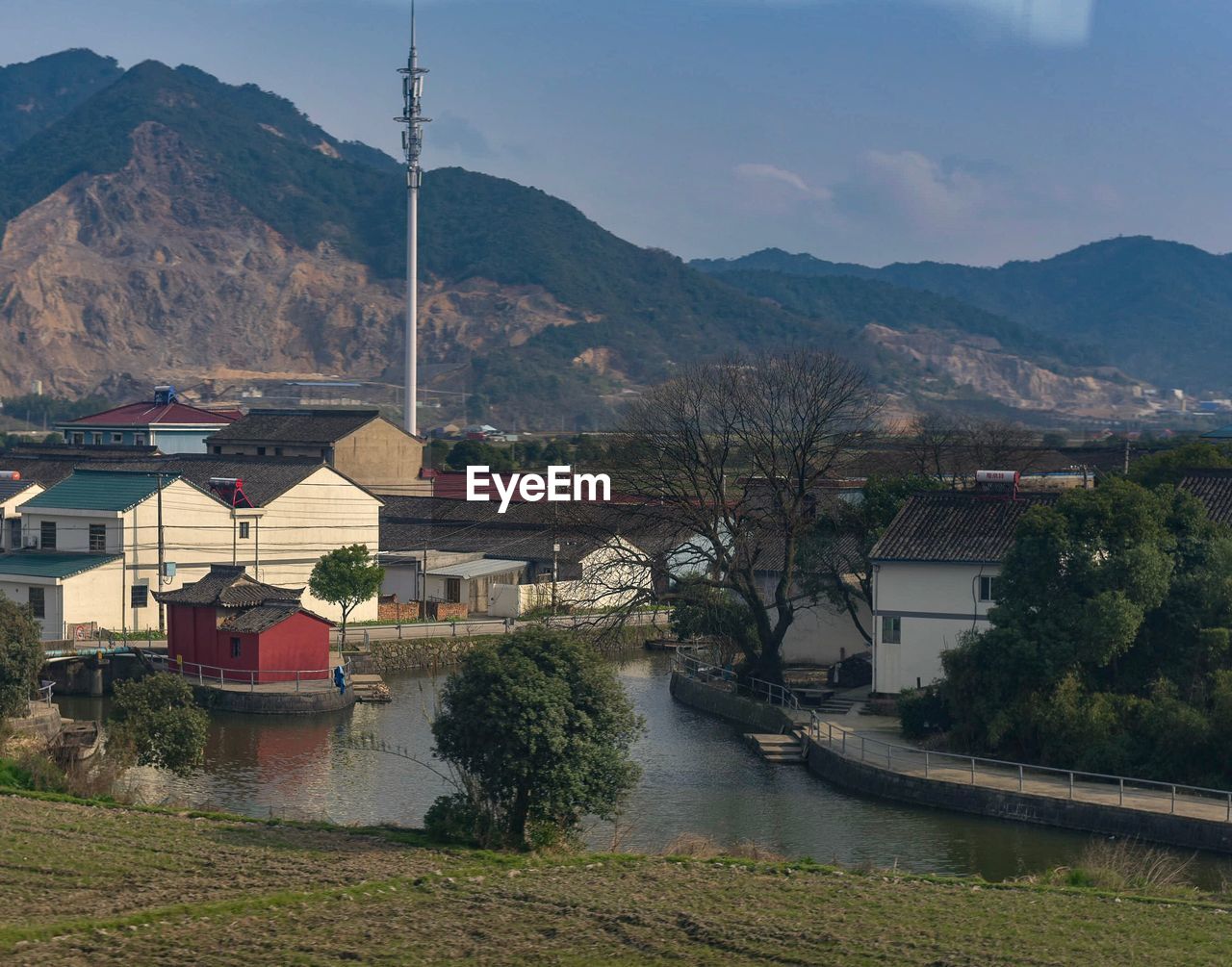 HOUSES ON TOWN AGAINST MOUNTAINS