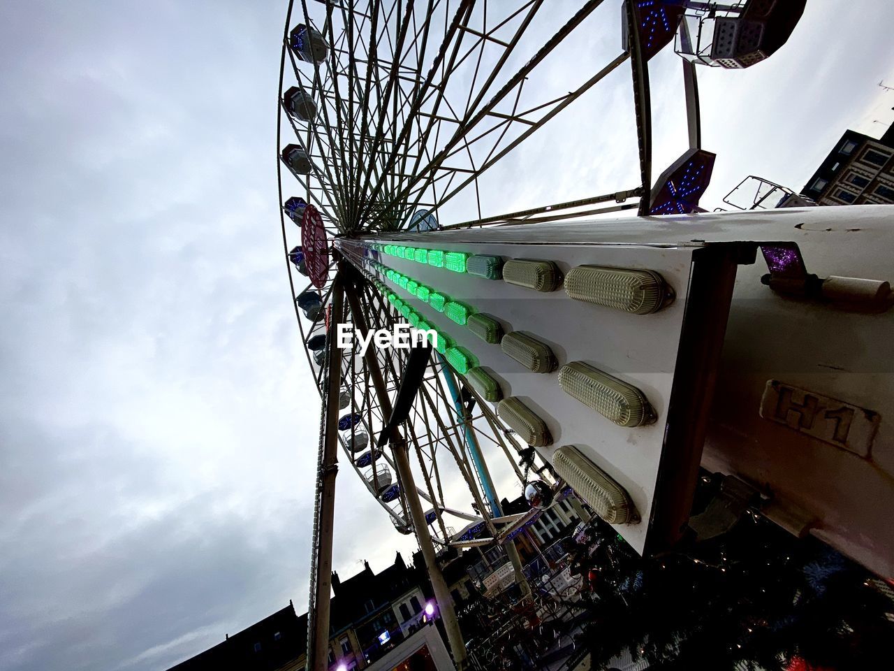 LOW ANGLE VIEW OF FERRIS WHEEL IN SKY