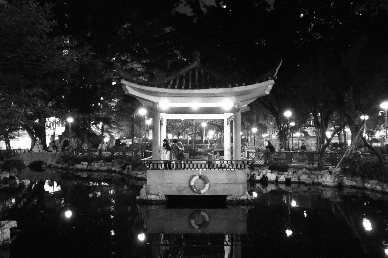 Reflection of gazebo in pond