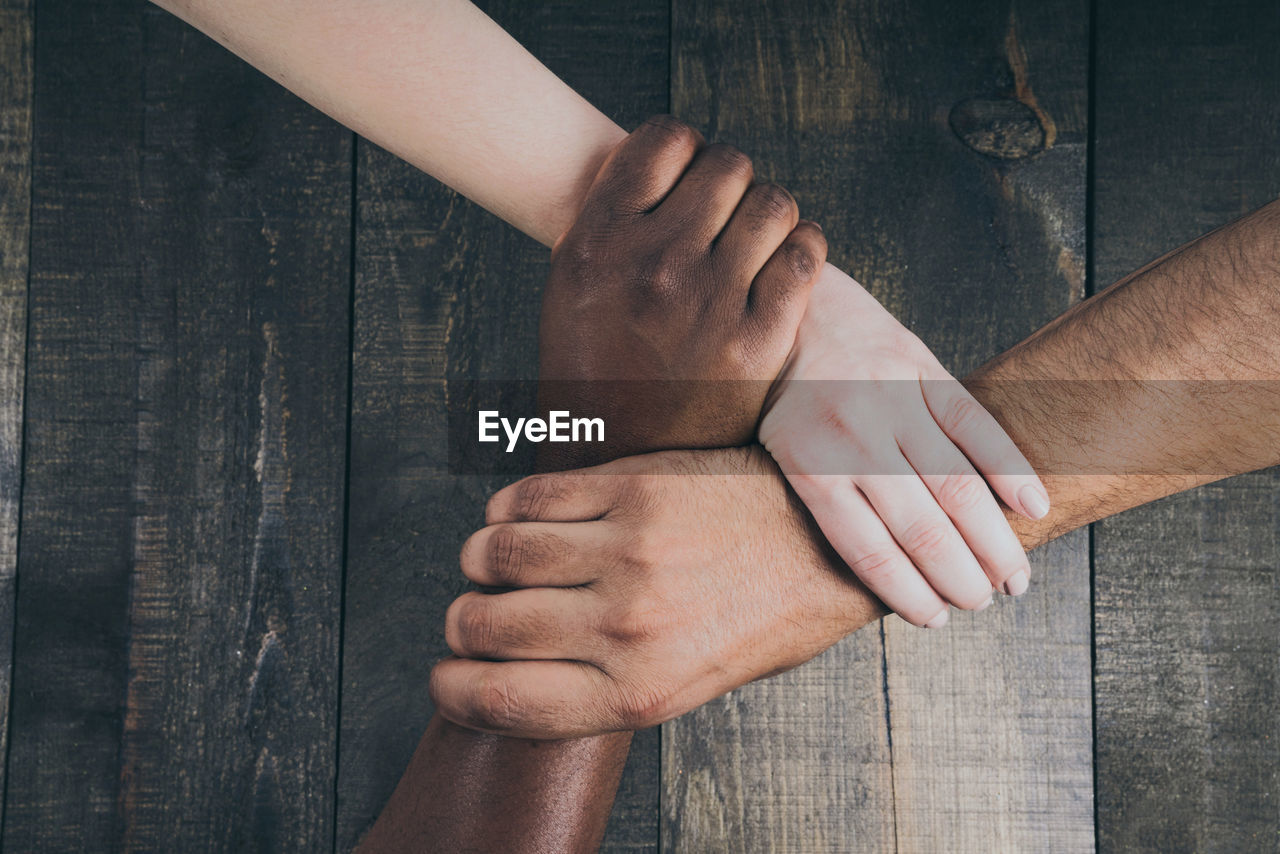 Cropped image of man holding hands