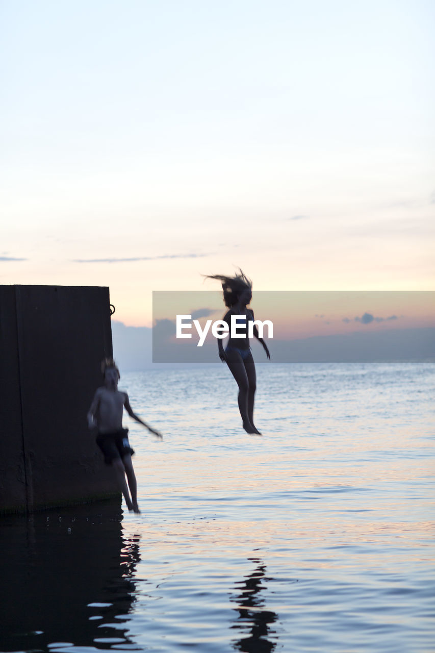 Youth jumping into sea, oland, sweden