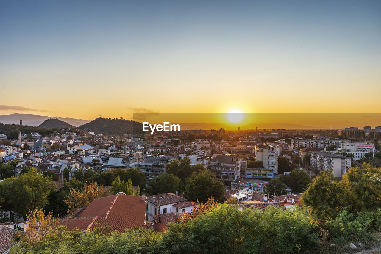 High angle view of townscape against sky during sunset