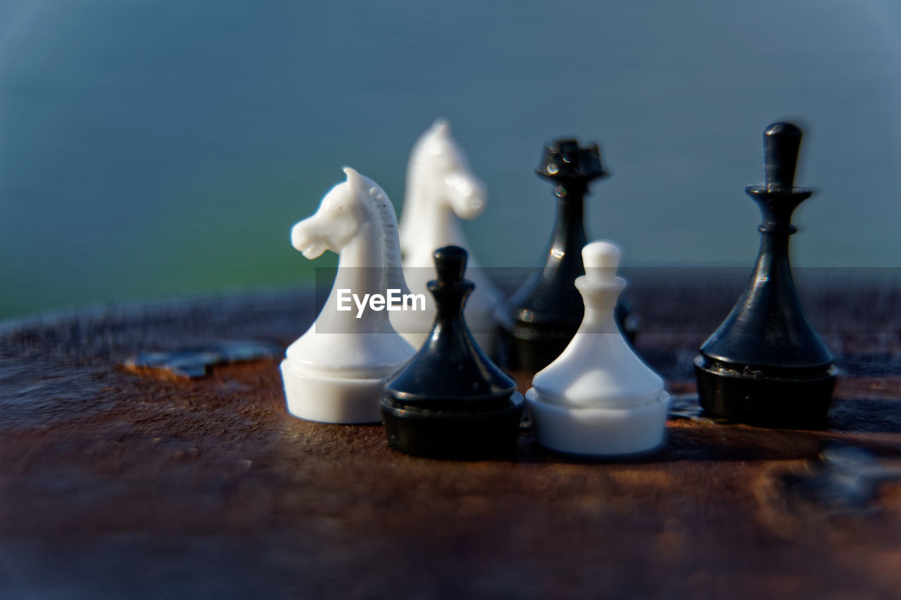 Close-up of chess pieces on table