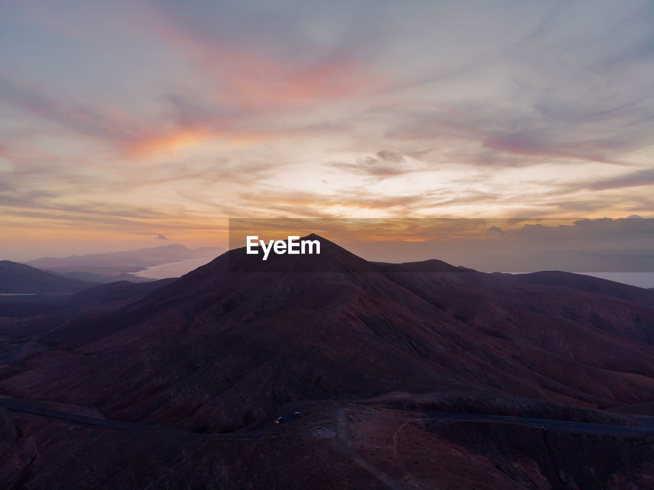 Scenic view of mountains against sky during sunset