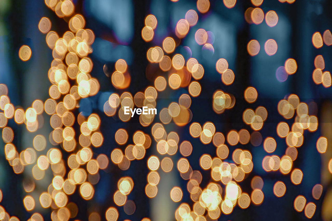 Defocused image of illuminated lights at night