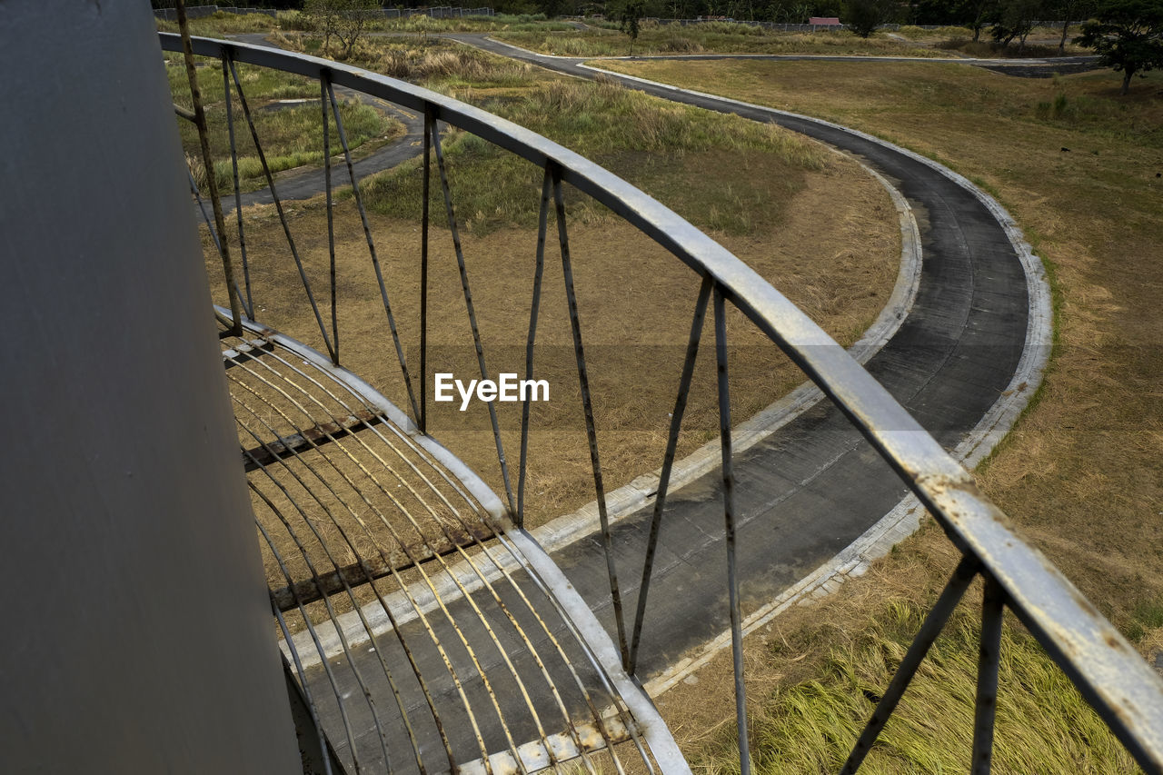 High angle view of railing by bridge